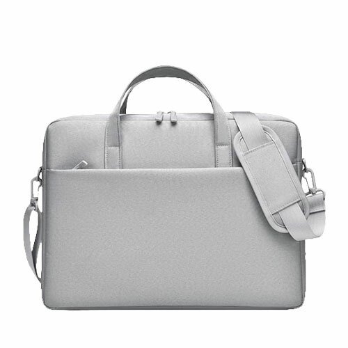 Sac ordinateur portable gris clair élégant, minimaliste et fonctionnel pour travail et déplacements.